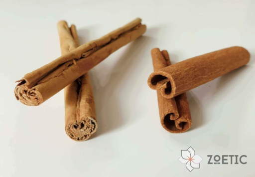 Picture of two main types of cinnamon by zoetic ltd for comparison. The picture is against a white background. the Ceylon cinnamon looks light brown in colour and the quils are soft and multi layerd. Cassia cinnamon has a Dark brown colour and with a single hard bark rolling into itself.